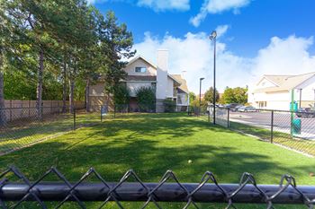 Exterior with a fenced green yard